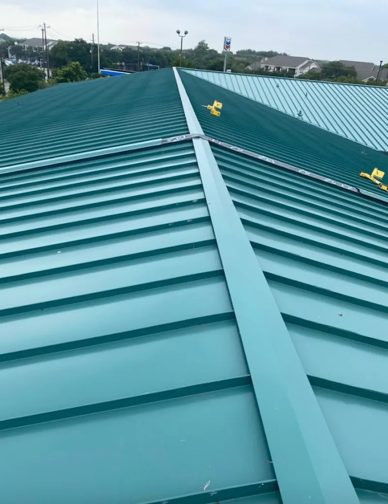 Green commercial metal roof ridge and valley for Metal Roof Repair in Madison